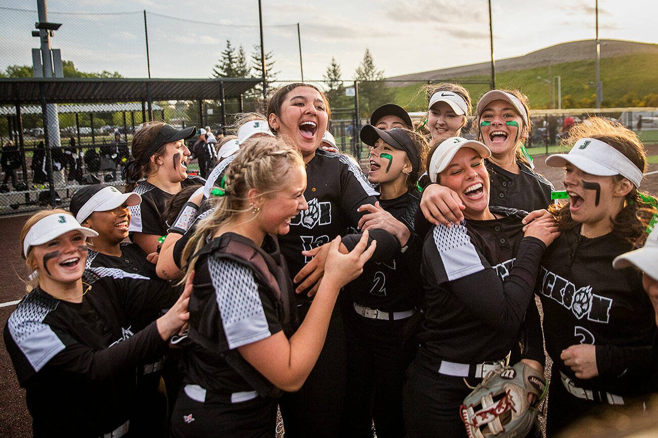 Jackson players react to beating Kamiak to win the 4A district championship on Friday, May 17, 2024 in Everett, Washington. (Olivia Vanni / The Herald)