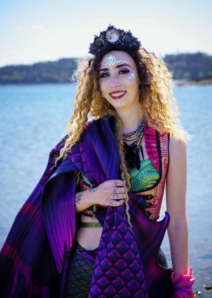 Phoenix Da Costa portrays Phoenix the Siren, a mermaid with ombre beachy waves. (Photo by David Welton)
