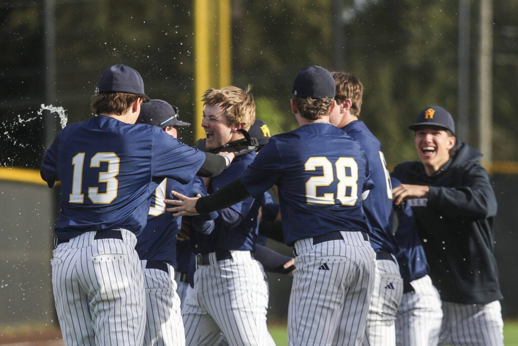 West Seattle players celebrate during a baseball game between Mountlake Terrace and West Seattle at Edmonds-Woodway High School in Edmonds, Washington on Saturday, May 18, 2024. Mountlake Terrace lost, 9-10.(Annie Barker / The Herald)

