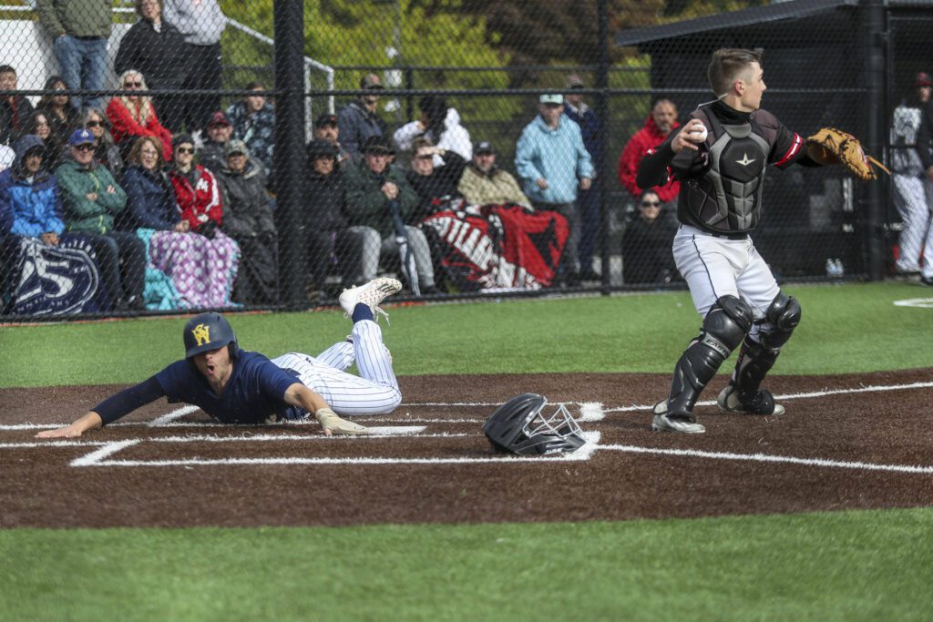 A West Seattle player scores during a baseball game between Mountlake Terrace and West Seattle at Edmonds-Woodway High School in Edmonds, Washington on Saturday, May 18, 2024. Mountlake Terrace lost, 9-10.(Annie Barker / The Herald)
