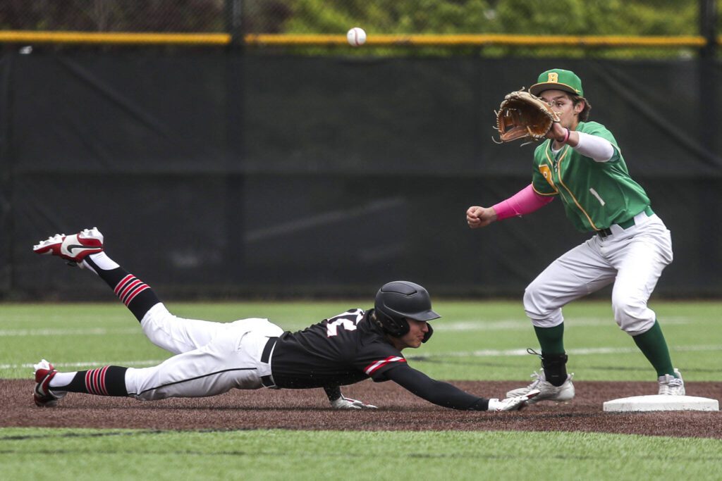 Mountlake Terrace’s Robert Swan (12) slides back to second during a baseball game between Mountlake Terrace and Bishop Blanchet at Edmonds-Woodway High School in Edmonds, Washington on Saturday, May 18, 2024. Mountlake Terrace won, 12-7.(Annie Barker / The Herald)
