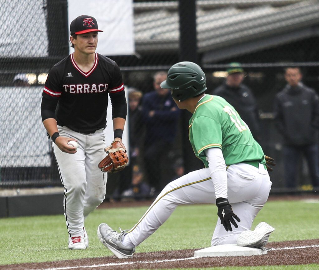Bishop Blanchet’s Noah Duenas (12) slides into third during a baseball game between Mountlake Terrace and Bishop Blanchet at Edmonds-Woodway High School in Edmonds, Washington on Saturday, May 18, 2024. Mountlake Terrace won, 12-7.(Annie Barker / The Herald)
