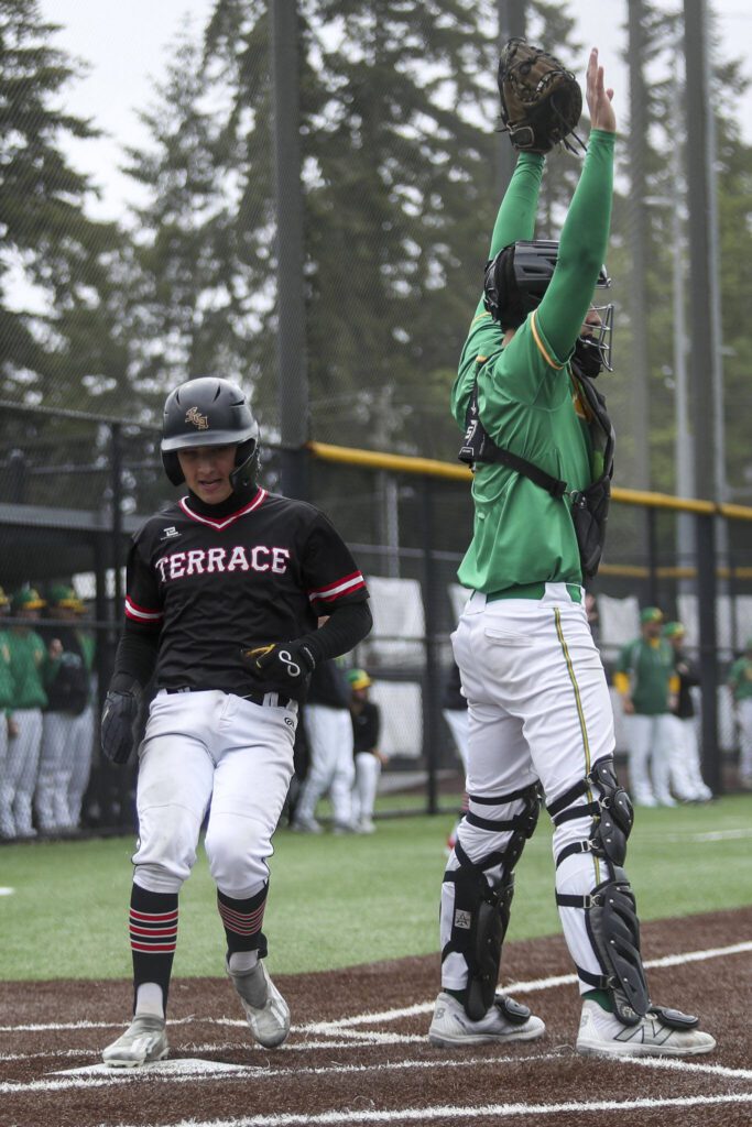 A Mountlake Terrace player scores during a baseball game between Mountlake Terrace and Bishop Blanchet at Edmonds-Woodway High School in Edmonds, Washington on Saturday, May 18, 2024. Mountlake Terrace won, 12-7.(Annie Barker / The Herald)
