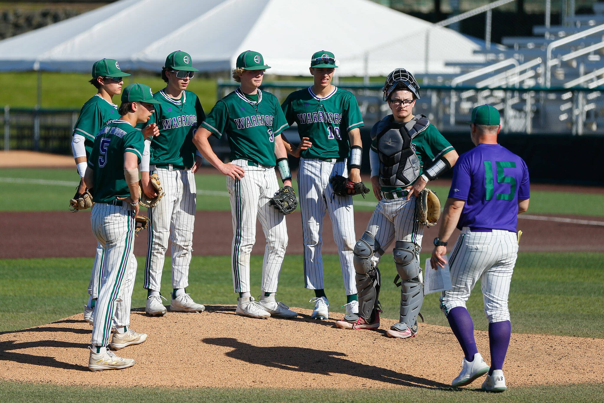 Edmonds-Woodway comes together for a mound visit during early trouble against Mountlake Terrace in the Class 3A District 1 baseball championship Saturday, May 11, 2024, at Funko Field in Everett, Washington. (Ryan Berry / The Herald)