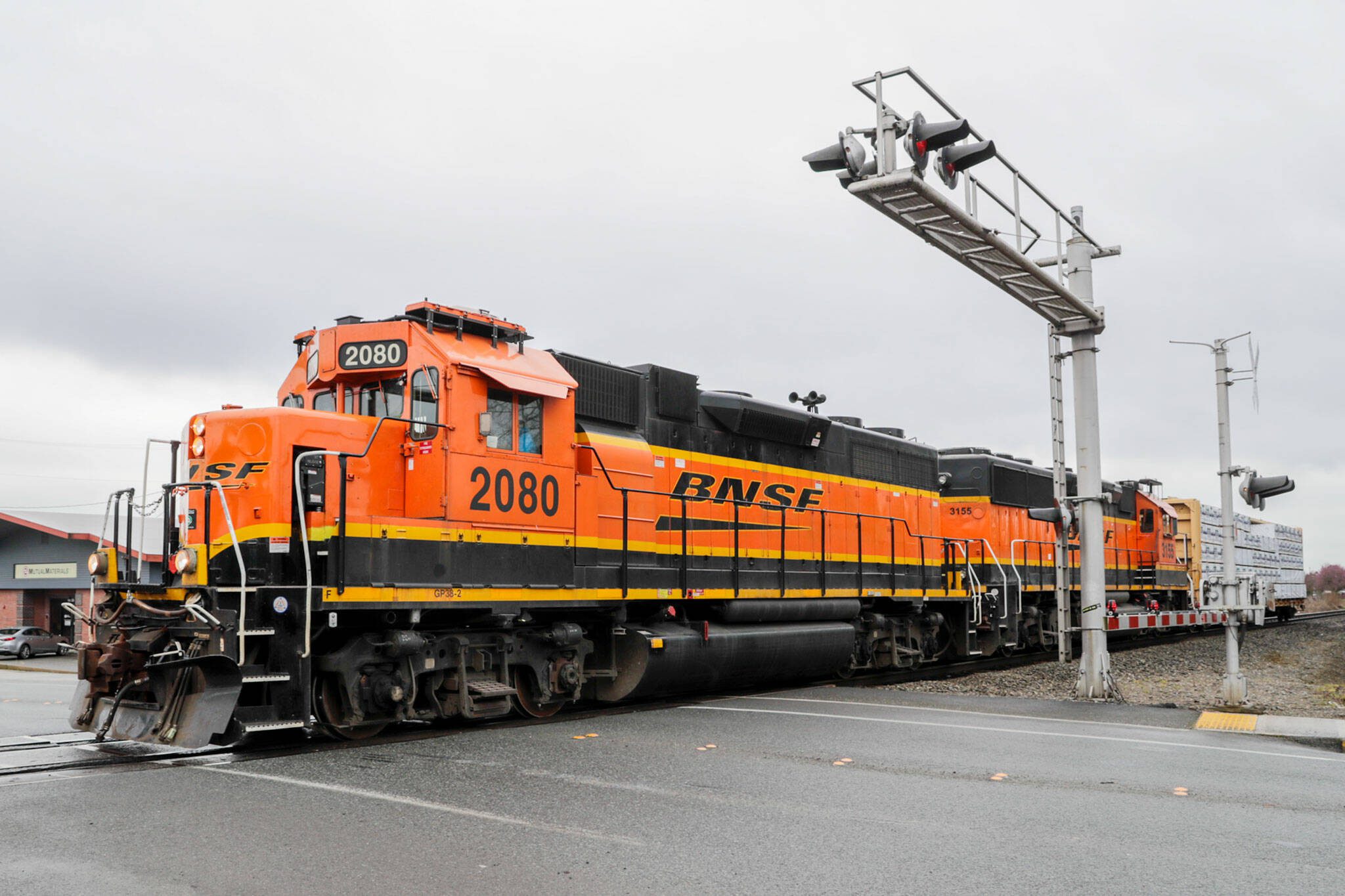 A BNSF train crosses Grove St/72nd St, NE in Marysville, Washington on March 17, 2022. Marysville recently got funding for design work for an overcrossing at the intersection. (Kevin Clark / The Herald)