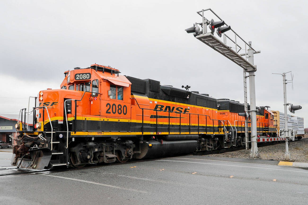 A BNSF train crosses Grove St/72nd St, NE in Marysville, Washington on March 17, 2022. Marysville recently got funding for design work for an overcrossing at the intersection. (Kevin Clark / The Herald)