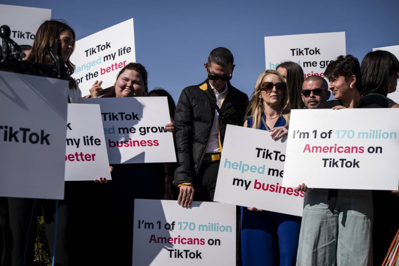 TikTok content creators at a news conference with several House Democrats on Capitol Hill on March 12. A bill that would force a sale of TikTok by its Chinese owner, ByteDance — or ban it outright — was passed by the Senate and was signed into law by President Biden; now the process is likely to get even more complicated. (Haiyun Jiang / The New York Times file photo)