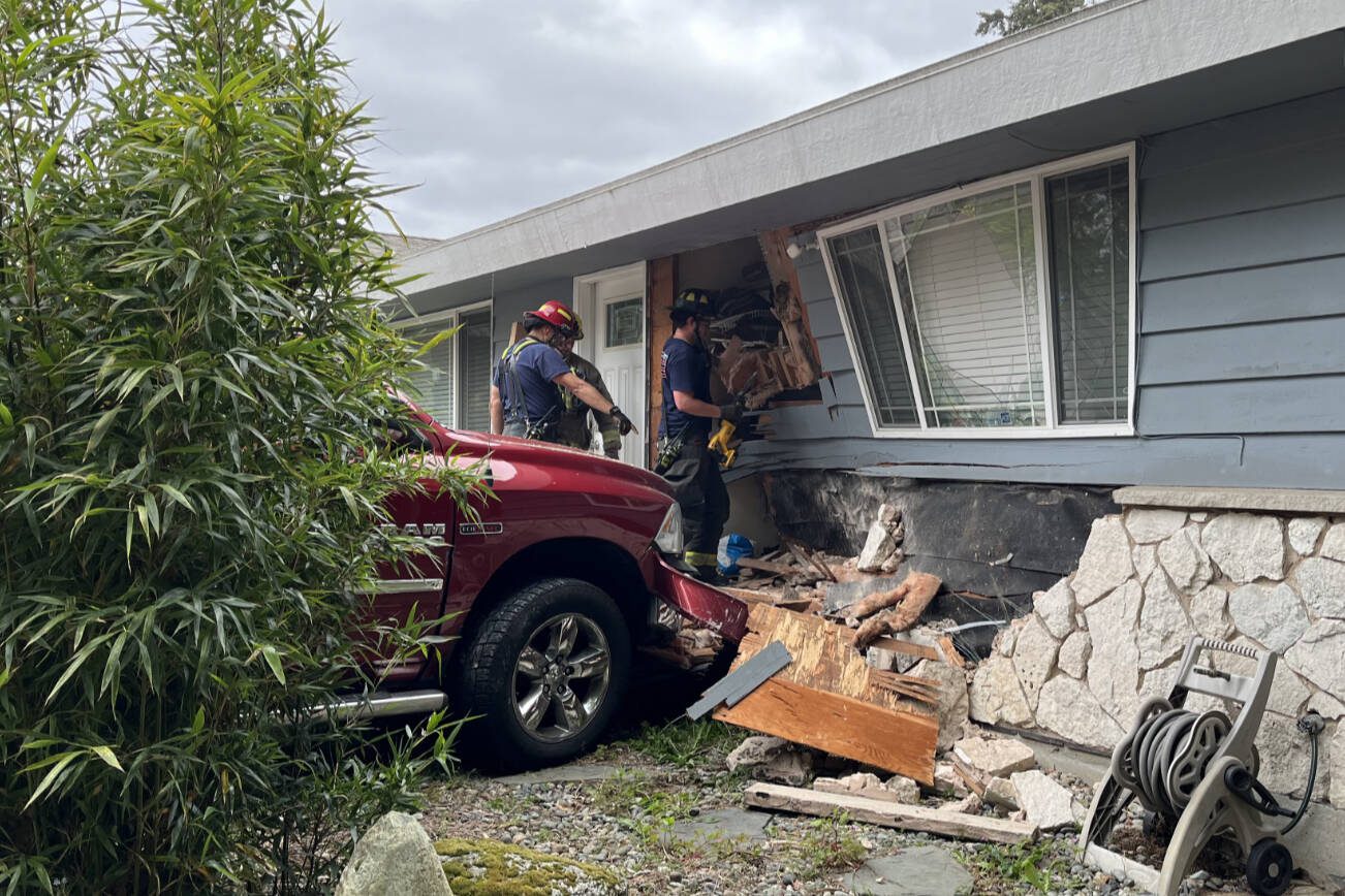 A truck towing a travel trailer crashed into a home in the Esperance neighborhood Thursday, May 23, 2024, in Edmonds, Washington. (South County Fire)