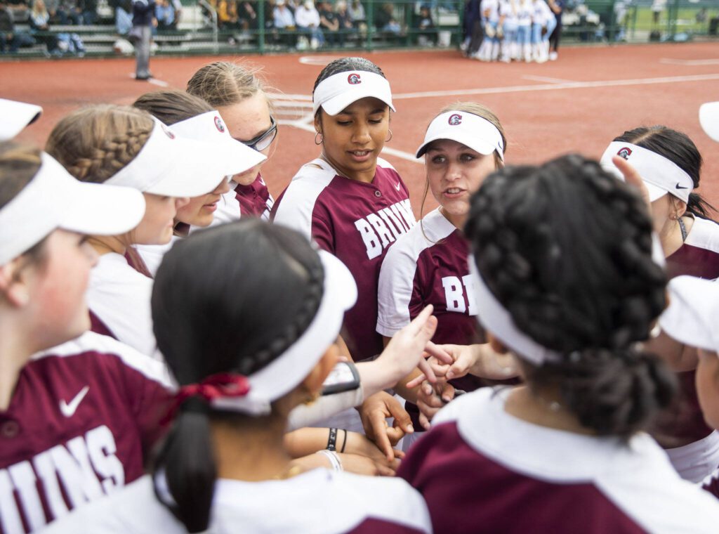 Cascade players huddle before the 3A state softball tournament game against Gig Harbor on Thursday, May 23, 2024 in Lacey, Washington. (Olivia Vanni / The Herald)
