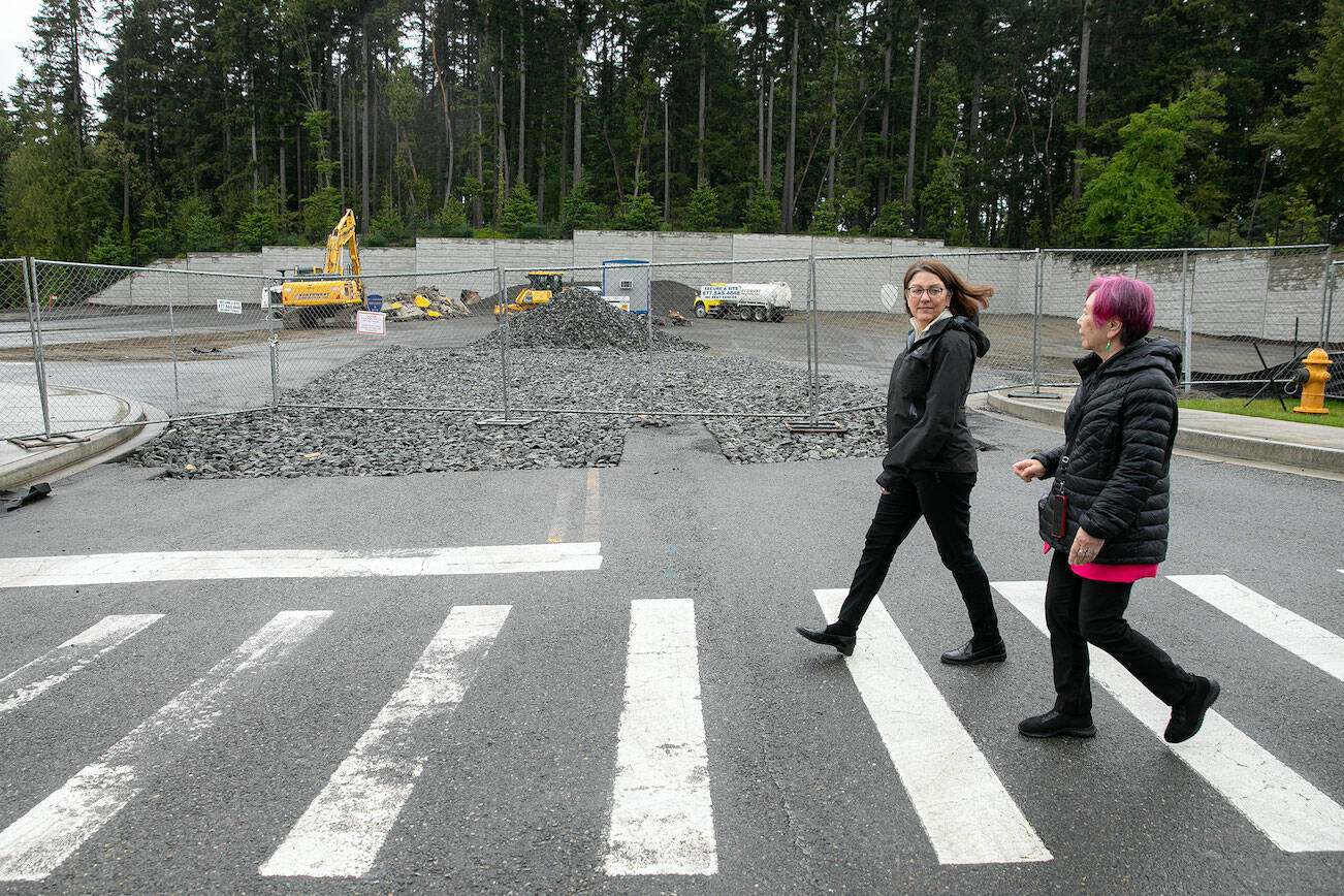 Rep. Suzanne DelBene and Mayor Kyoko Matsumoto Wright walk past a future apartment development during a tour and discussion with community leaders regarding the Mountlake Terrace Main Street Revitalization project on Tuesday, May 28, 2024, in Mountlake Terrace, Washington. (Ryan Berry / The Herald)