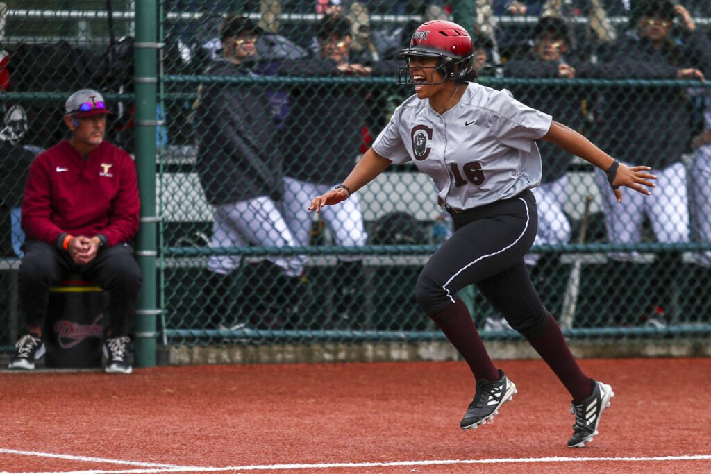 Cascade’s Jaidyn Wilson (16) celebrates a home run during a 3A softball game between Cascade and University at the regional athletic complex in Lacey, Washington on Friday, May 24, 2024. Cascade fell, 6-7. (Annie Barker / The Herald)
