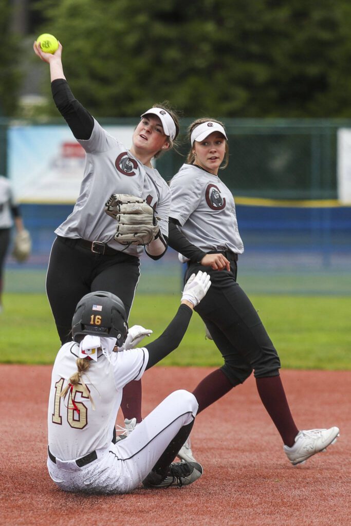 Cascade’s Lauryn Thompson (11) throws the ball during a 3A softball game between Cascade and University at the regional athletic complex in Lacey, Washington on Friday, May 24, 2024. Cascade fell, 6-7. (Annie Barker / The Herald)
