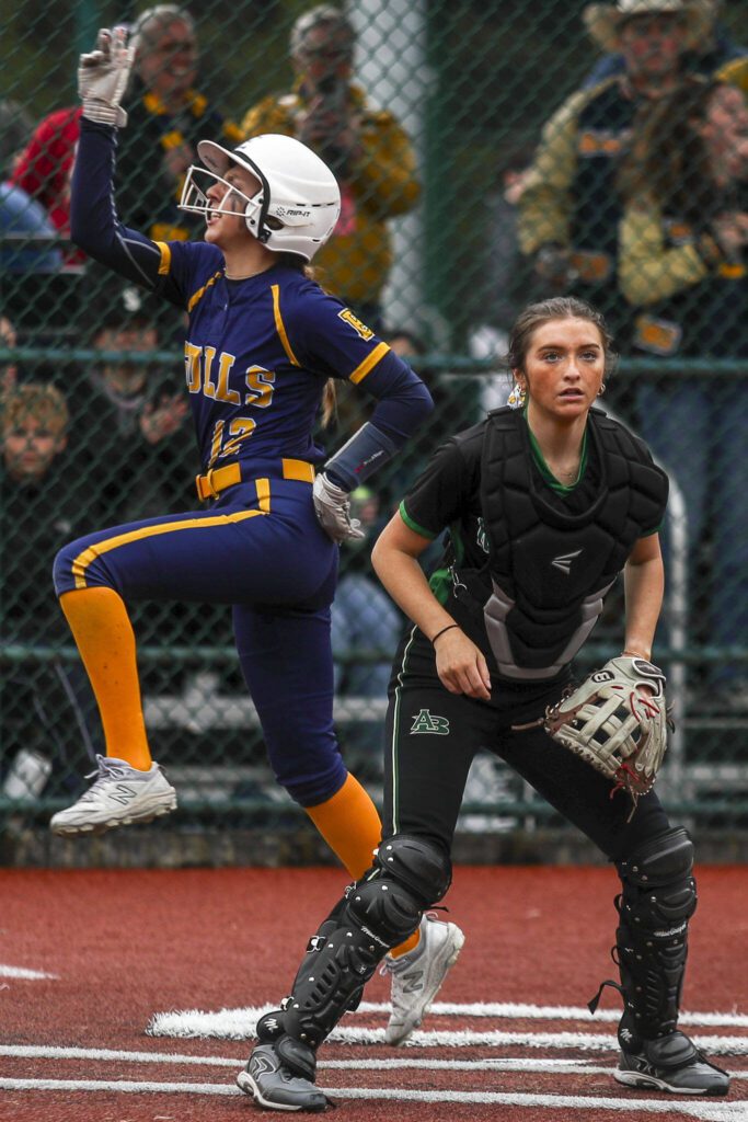 Everett’s Braylon Yarwood (12) scores during a 3A softball game between Everett and Roosevelt at the regional athletic complex in Lacey, Washington on Friday, May 24, 2024. Everett fell in the eighth, 7-8. (Annie Barker / The Herald)
