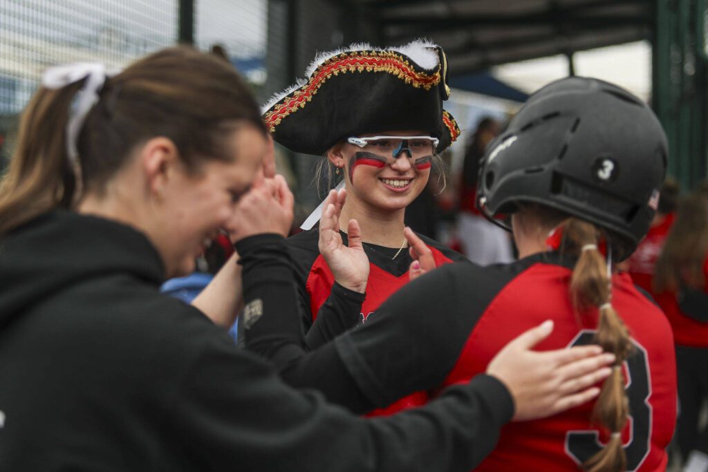 Snohomish players high-five during a 3A softball game between Snohomish and Seattle Prep at the regional athletic complex in Lacey, Washington on Friday, May 24, 2024. Snohomish won, 8-0. (Annie Barker / The Herald)
