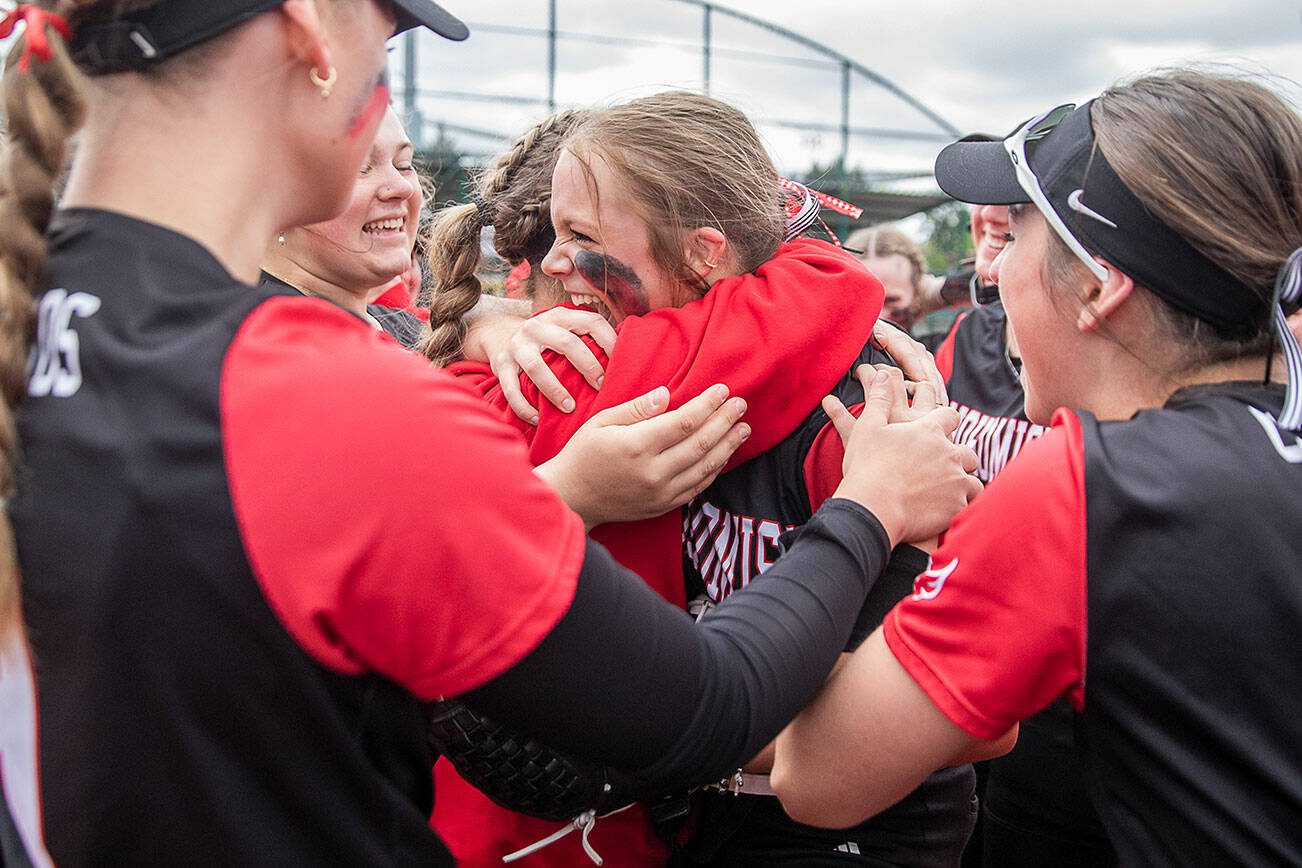 Snohomish players celebrate beating Garfield in the 3A state softball semifinal game to advance to the championship on Saturday, May 25, 2024 in Lacey, Washington. (Olivia Vanni / The Herald)