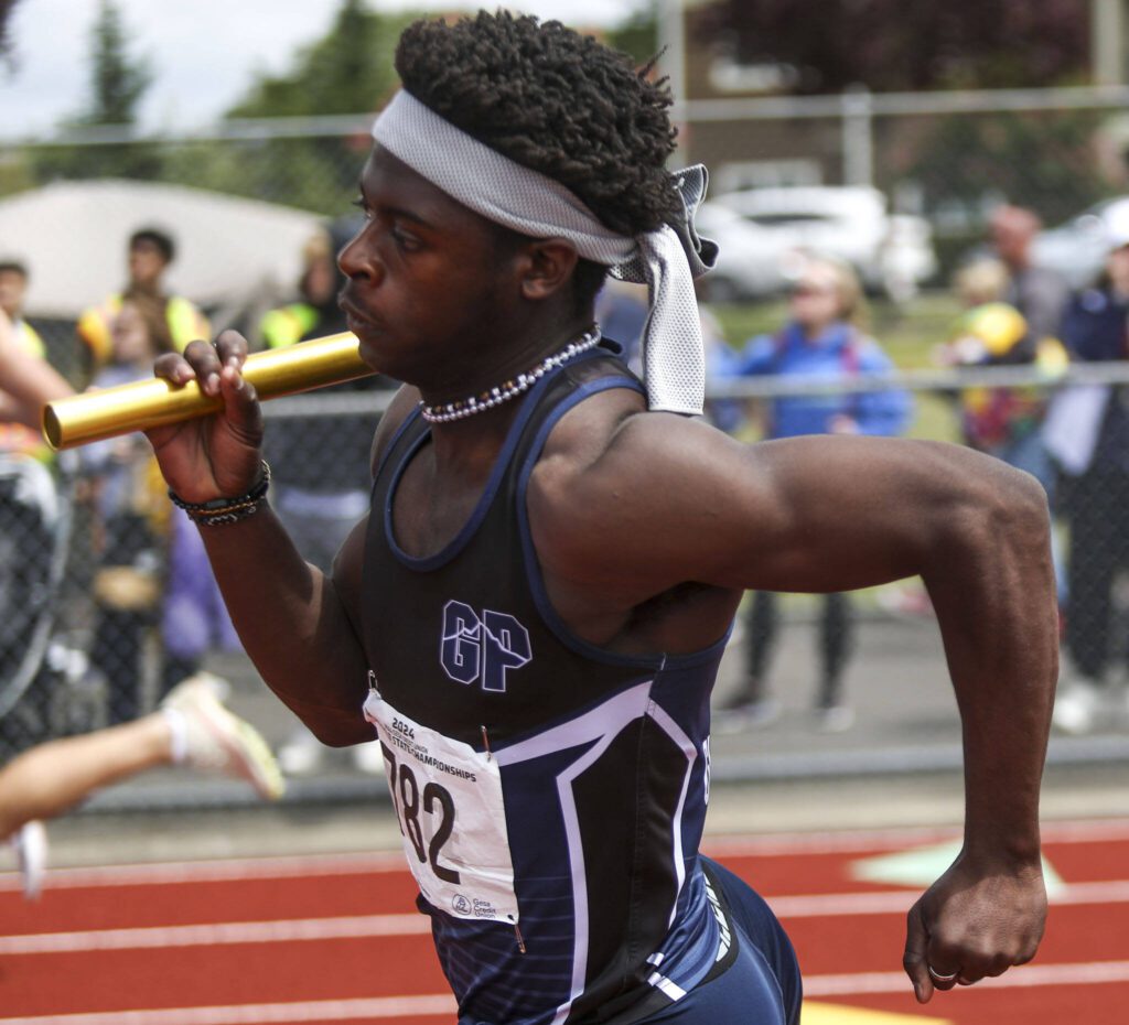 A Glacier Peak runner participates in the Boys 4x100M 4A relay during the Class 4A, 3A, 2A track and field state championships at Mount Tahoma High School in Tacoma, Washington on Saturday, May 25, 2024. (Annie Barker / The Herald)
