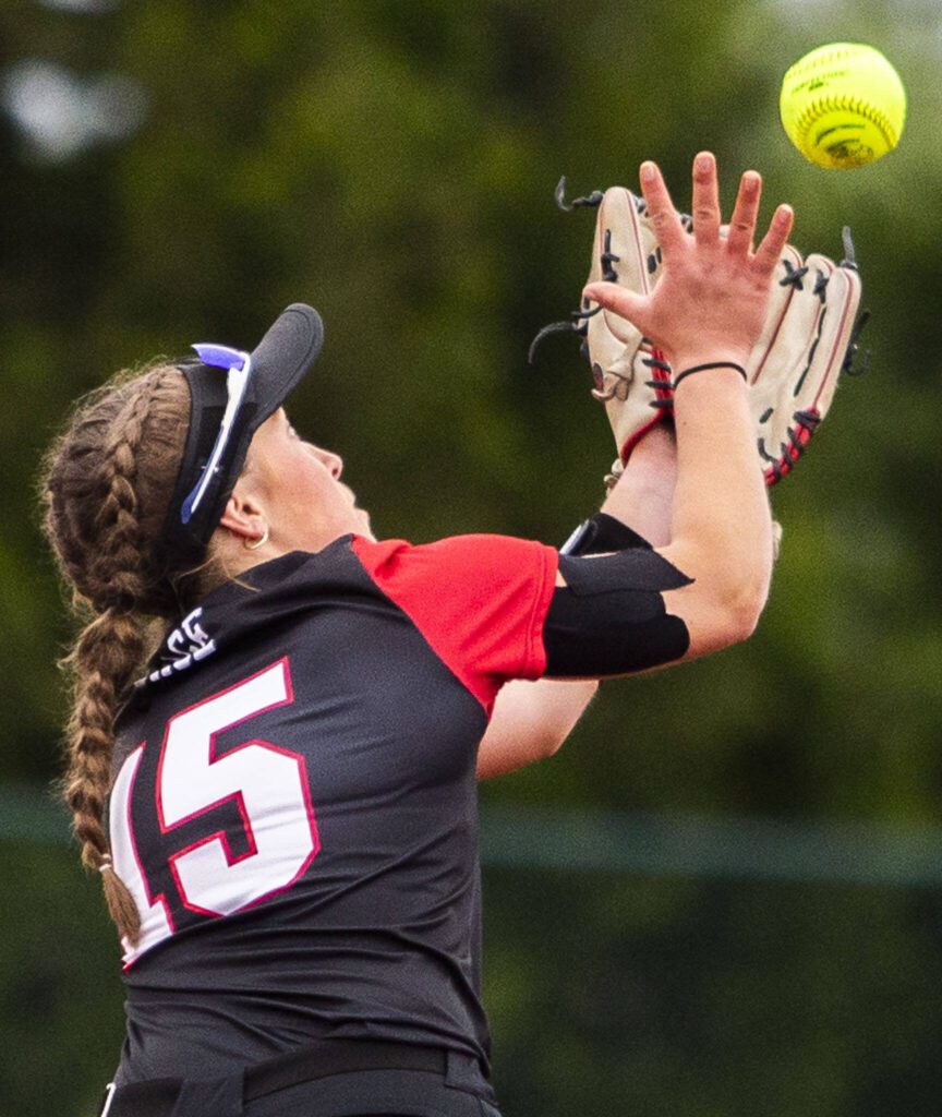Snohomish’s Camryn Sage reach sup to make a catch during the 3A state softball championship game against Auburn Riverside on Saturday, May 25, 2024 in Lacey, Washington. (Olivia Vanni / The Herald)
