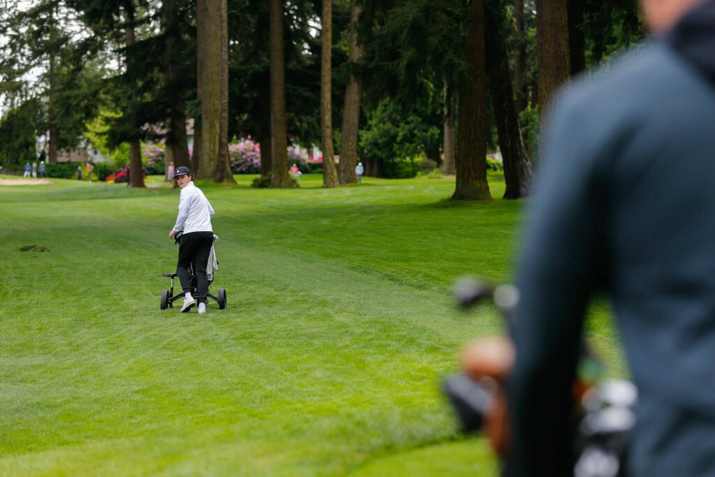 Palmer Mucheson walks along the fairway during the 93rd Annual Snohomish County Amateur Championship on Monday, May 27, 2024, at the Everett Golf and Country Club in Everett, Washington. (Ryan Berry / The Herald)
