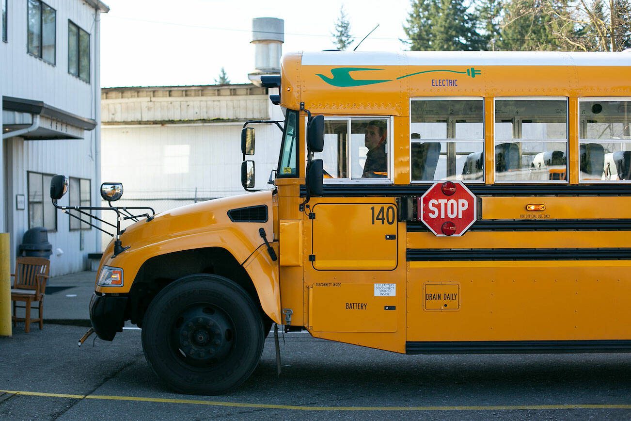 Snohomish School District Transportation Supervisor Karl Hereth backs up the district’s one electric school bus Thursday, March 6, 2024, at the district bus depot in Snohomish, Washington. (Ryan Berry / The Herald)