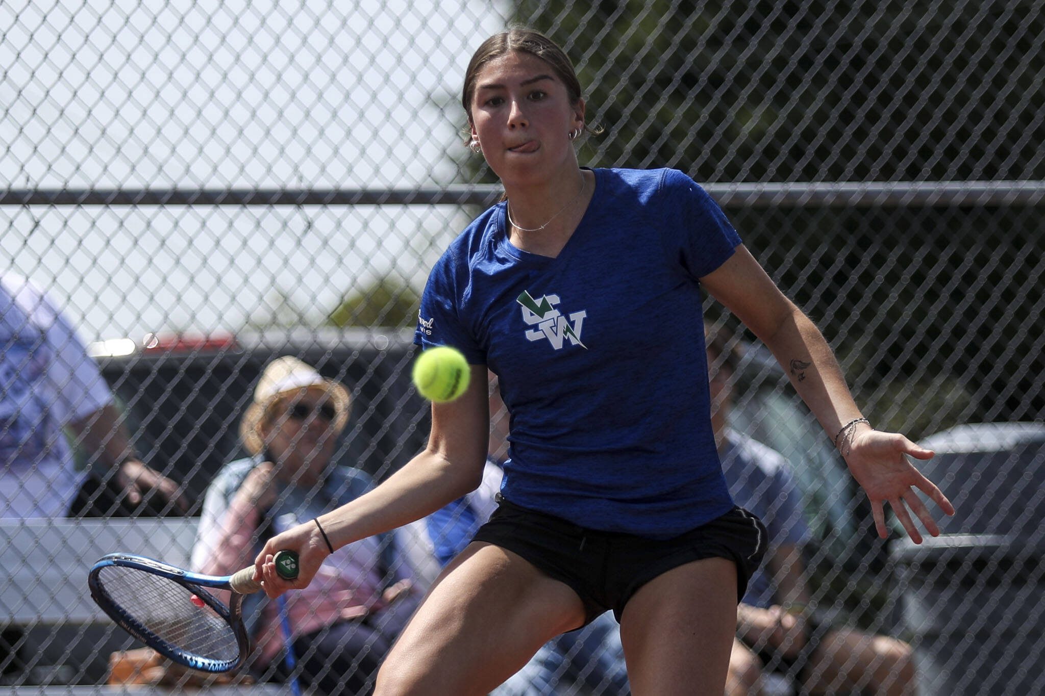 Shorewood’s Emily Lin hits the ball during a Class 3A District 1 girls tennis tournament at Snohomish High School in Snohomish, Washington on Wednesday, May 15, 2024. (Annie Barker / The Herald)