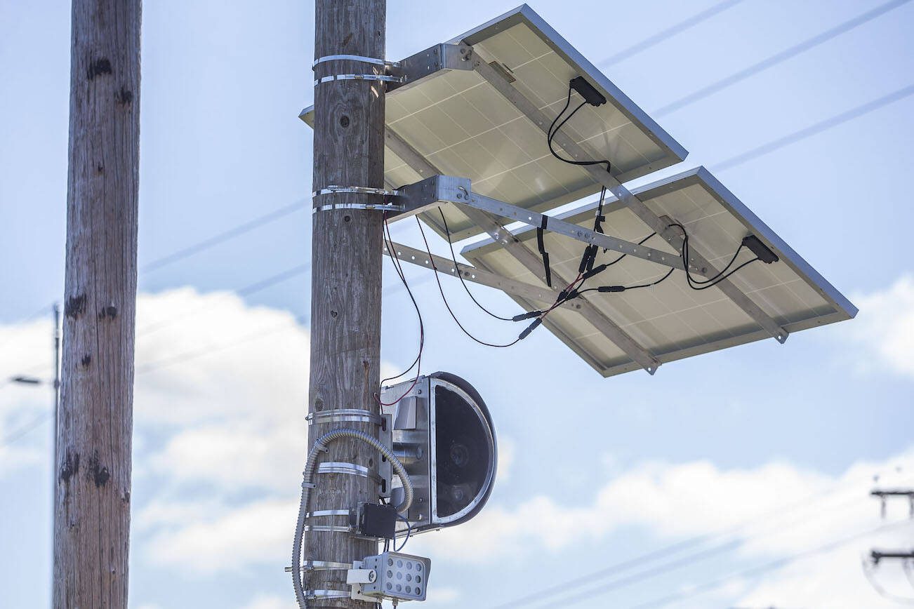 A truck drives west along Casino Road past a new speed camera set up near Horizon Elementary on Wednesday, May 8, 2024 in Everett, Washington. (Olivia Vanni / The Herald)