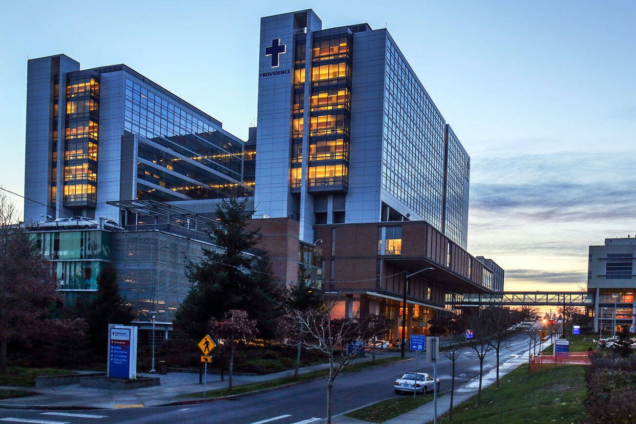 Providence Hospital in Everett at sunset Monday night on December 11, 2017. Officials Providence St. Joseph Health Ascension Health reportedly are discussing a merger that would create a chain of hospitals, including Providence Regional Medical Center Everett, plus clinics and medical care centers in 26 states spanning both coasts. (Kevin Clark / The Daily Herald)