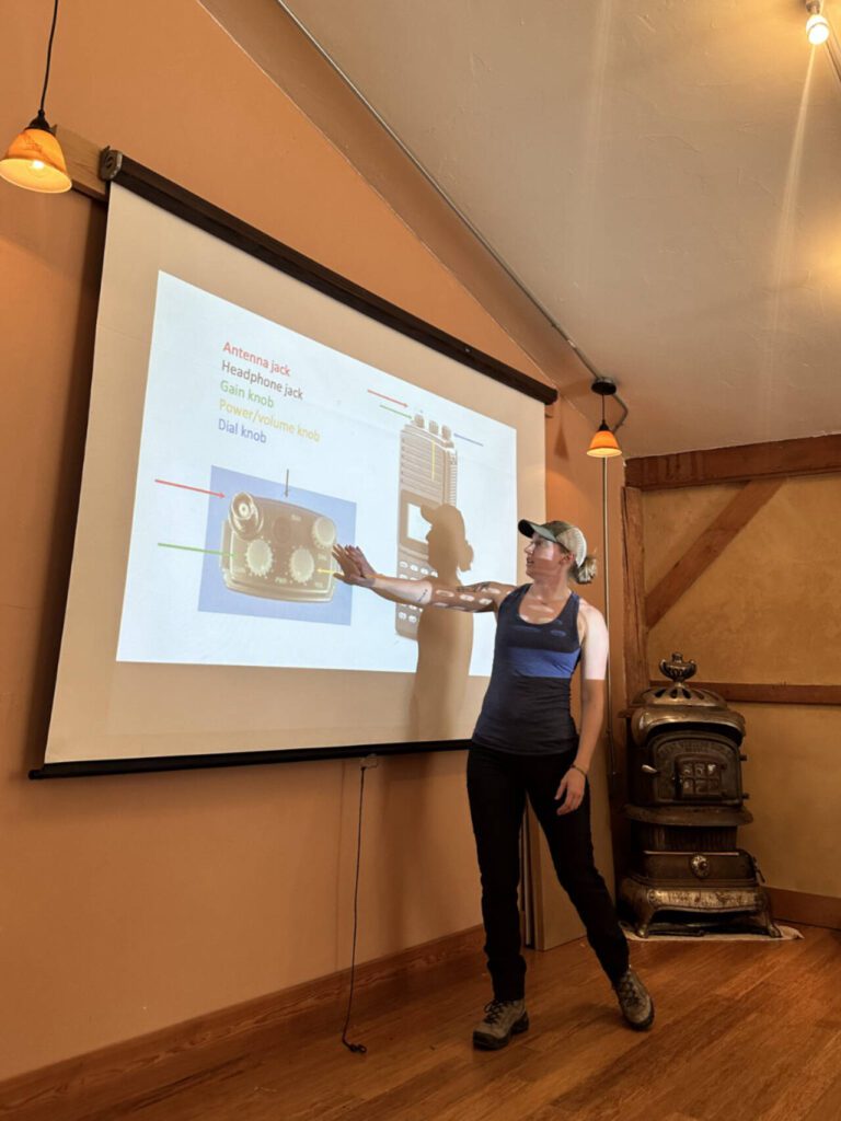 Anna Machowicz, education director and co-founder for the nonprofit Home Range, instructs a lesson in radio telemetry June, 2023 in Mazama, Washington. (So Sinopoulos-Lloyd)
