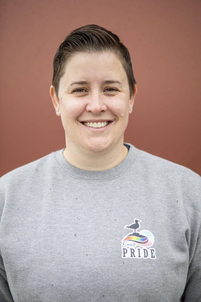 Everett Pride board member Ashley Turner poses for a photo at South Fork Bakery in Everett, Washington on Sunday, May 26, 2024. (Annie Barker / The Herald)
