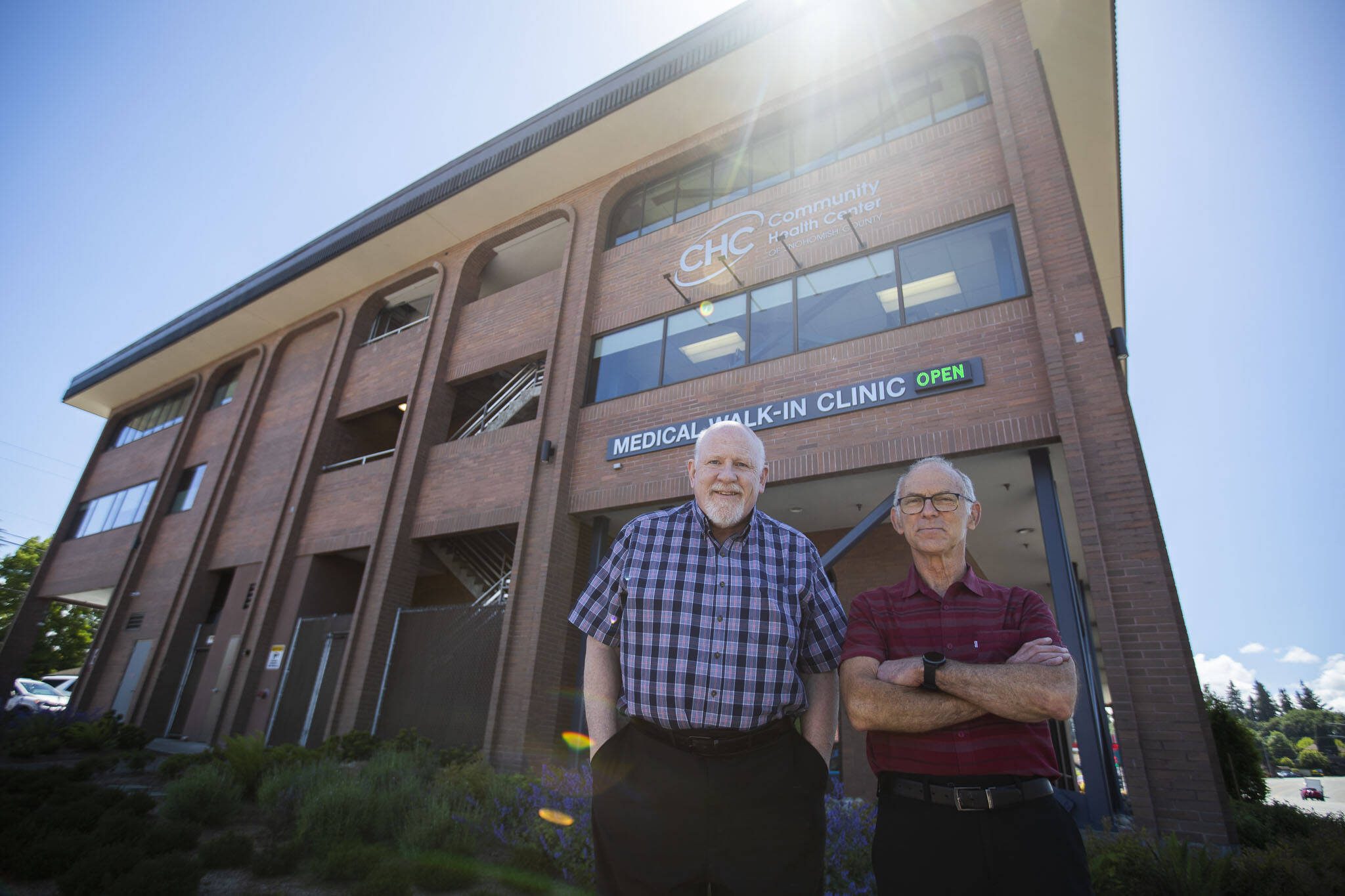 Dr. Scott Macfee and Dr. Daniel Goodman outside of the Community Health Center on Wednesday, June 12, 2024 in Everett, Washington. (Olivia Vanni / The Herald)