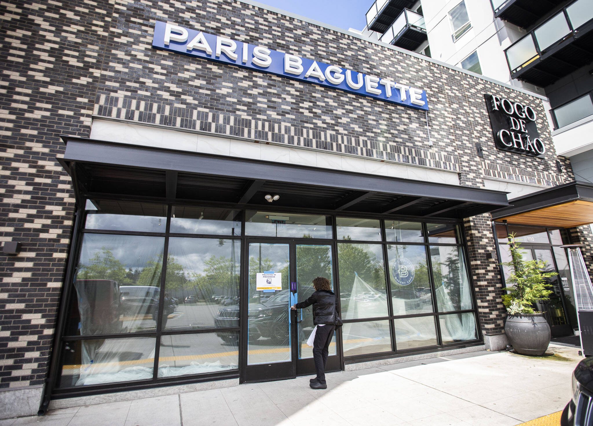 A person walks into Paris Baguette next to the Alderwood Mall on Thursday, May 30, 2024 in Lynnwood, Washington. This is the first Paris Baguette location to open in Washington. (Olivia Vanni / The Herald)