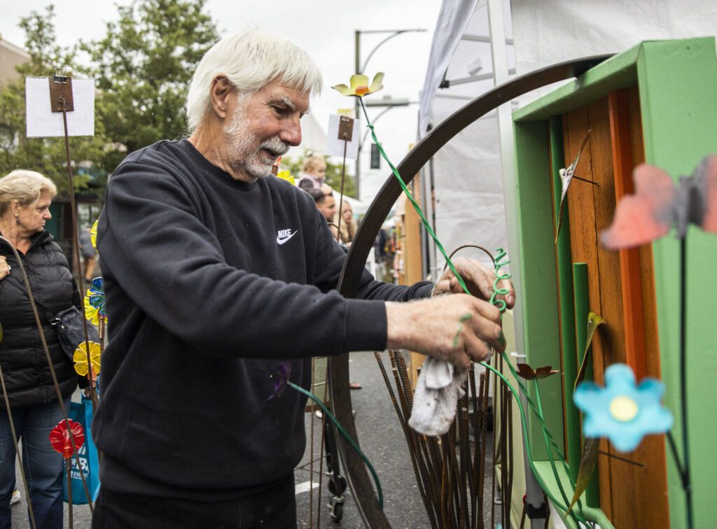 Rob Leavitt, owner of Architectural Hardscapes, assembles one of his pieces during the first day of Sorticulture on Friday, June 9, 2023 in Everett, Washington. (Olivia Vanni / The Herald)
