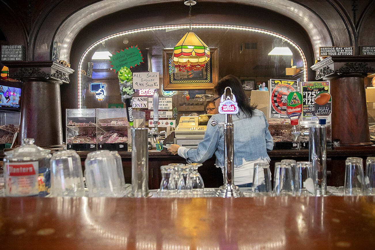 Denise McKenzie, who has been a bartenders at Kuhnle’s Tavern for many years, works behind the bar on Monday, June 17, 2024 in Marysville, Washington. (Olivia Vanni / The Herald)
