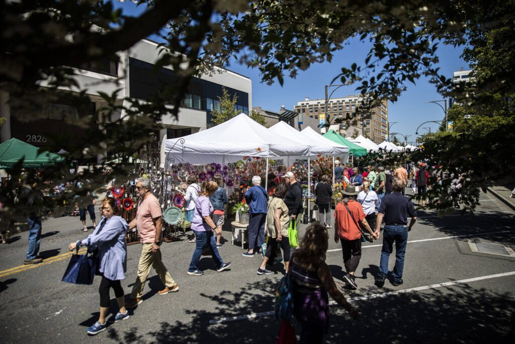 People walk through Sorticulture on Friday, June 7, 2024, in Everett, Washington. (Olivia Vanni / The Herald)
