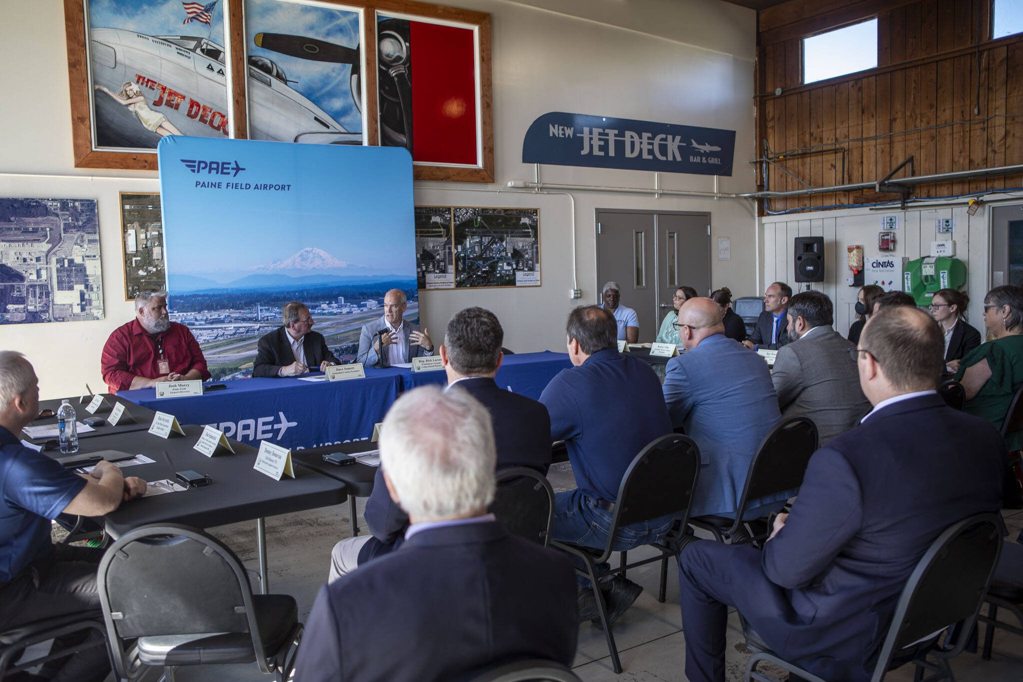 Rep. Rick Larsen, center, during a roundtable discussion at the Paine Field Airport Maintenance Department in Everett, Washington on Thursday, June 6, 2024. Members of the industry discussed how the FAA Reauthorization bill, signed into law last month, is expected to benefit Paine Field. (Annie Barker / The Herald)
