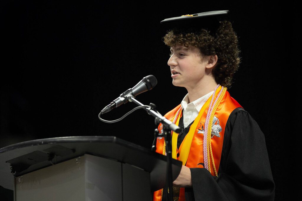 Mason Edwards, chosen by the faculty to speak, delivers an address during Monroe High School’s 2024 commencement on Wednesday, June 12, 2024, at Angel of the Winds Arena in Everett, Washington. (Ryan Berry / The Herald)
