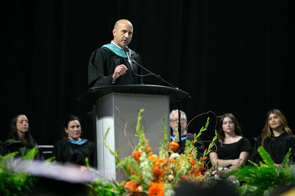 Principal Brett Wille speaks to his students one last time during Monroe High School’s 2024 commencement on Wednesday, June 12, 2024, at Angel of the Winds Arena in Everett, Washington. (Ryan Berry / The Herald)
