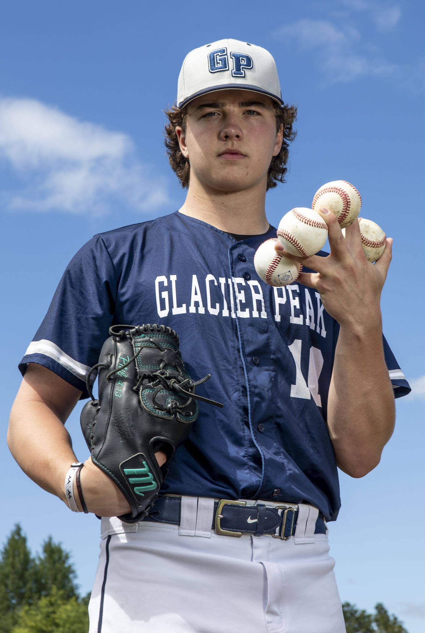 Glacier Peak’s Karsten Sweum (10) poses for a portrait as The Herald’s Baseball Player of the Year at Glacier Peak High School on Tuesday, June 18, 2024 in Snohomish, Washington. (Annie Barker / The Herald)