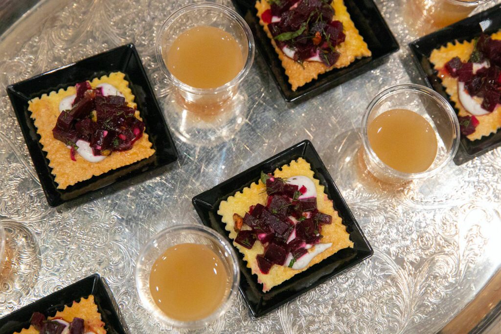 LJ’s Bistros’ elevated cheese and crackers with non-alcoholic rum at Crave! Northwest food festival at the Lynnwood Event Center on Friday, June 21, 2024, in Lynnwood, Washington. (Ryan Berry / The Herald)
