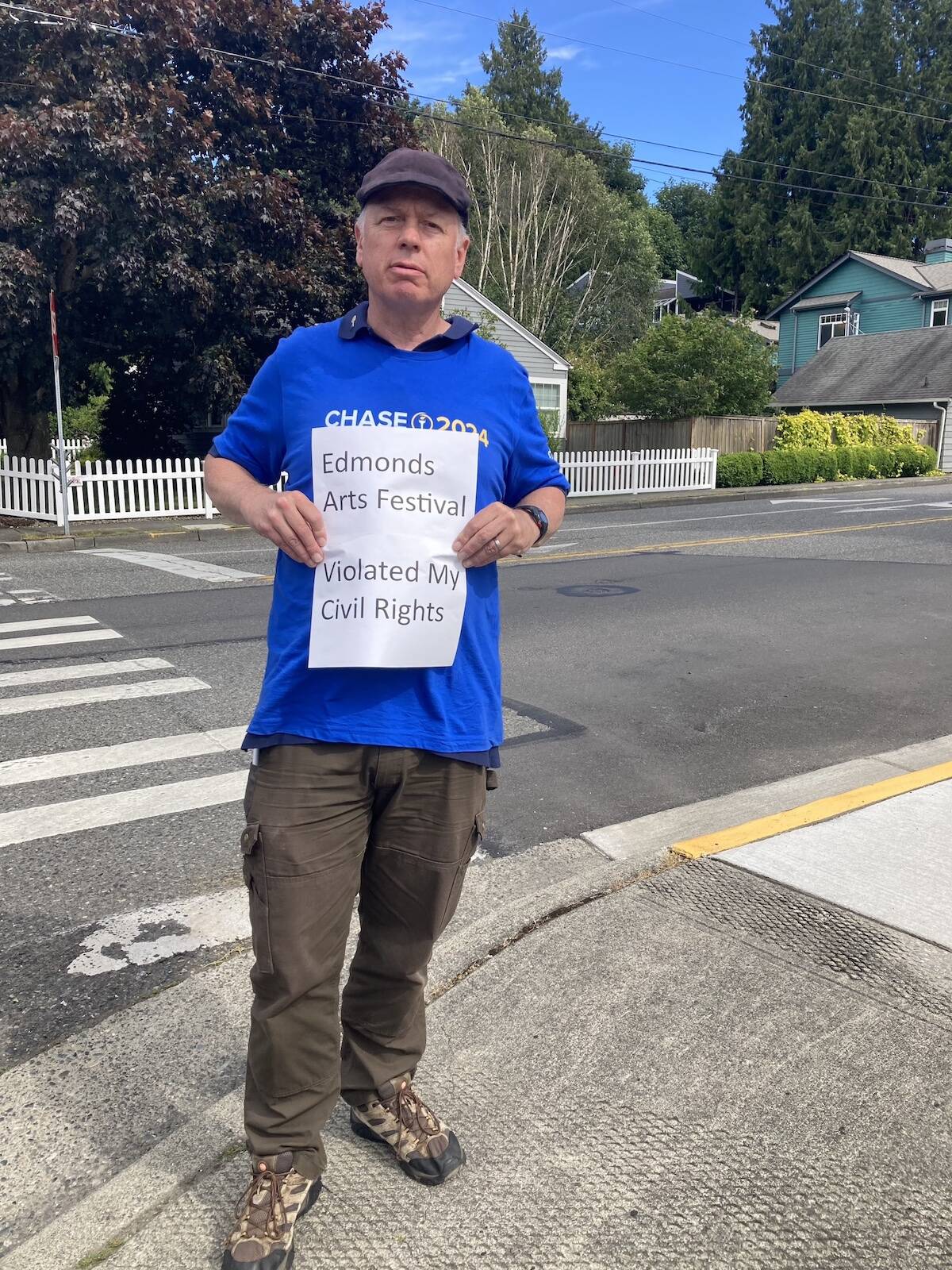 Bruce Guthrie outside the Frances Anderson Center, a public park owned by the city of Edmonds. Guthrie was arrested by arrested by Edmonds Police during the Edmonds Arts Festival for soliciting signatures on a petition to get Libertarian presidential candidate Chase Oliver on Washington’s ballot this year. (Photo provided by Bruce Guthrie)