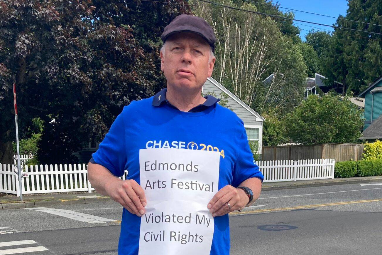 Bruce Guthrie outside the Frances Anderson Center, a public park owned by the city of Edmonds. Guthrie was arrested by arrested by Edmonds Police during the Edmonds Arts Festival for soliciting signatures on a petition to get Libertarian presidential candidate Chase Oliver on Washington’s ballot this year. (Photo provided by Bruce Guthrie)