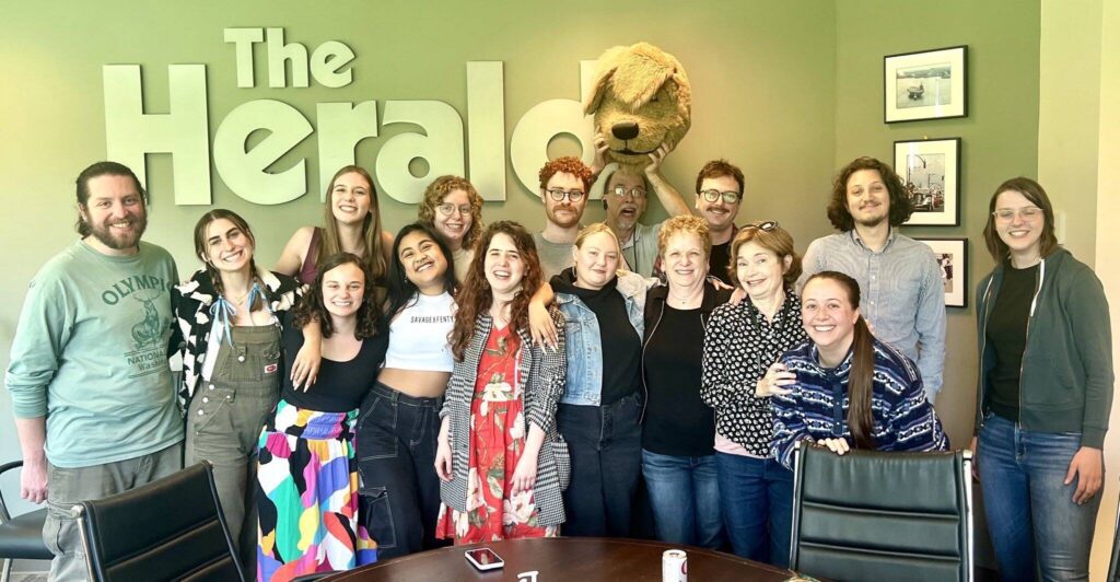 Herald staff members pose for a photo. Seven of the 16 pictured have been laid off. (Photo provided)
