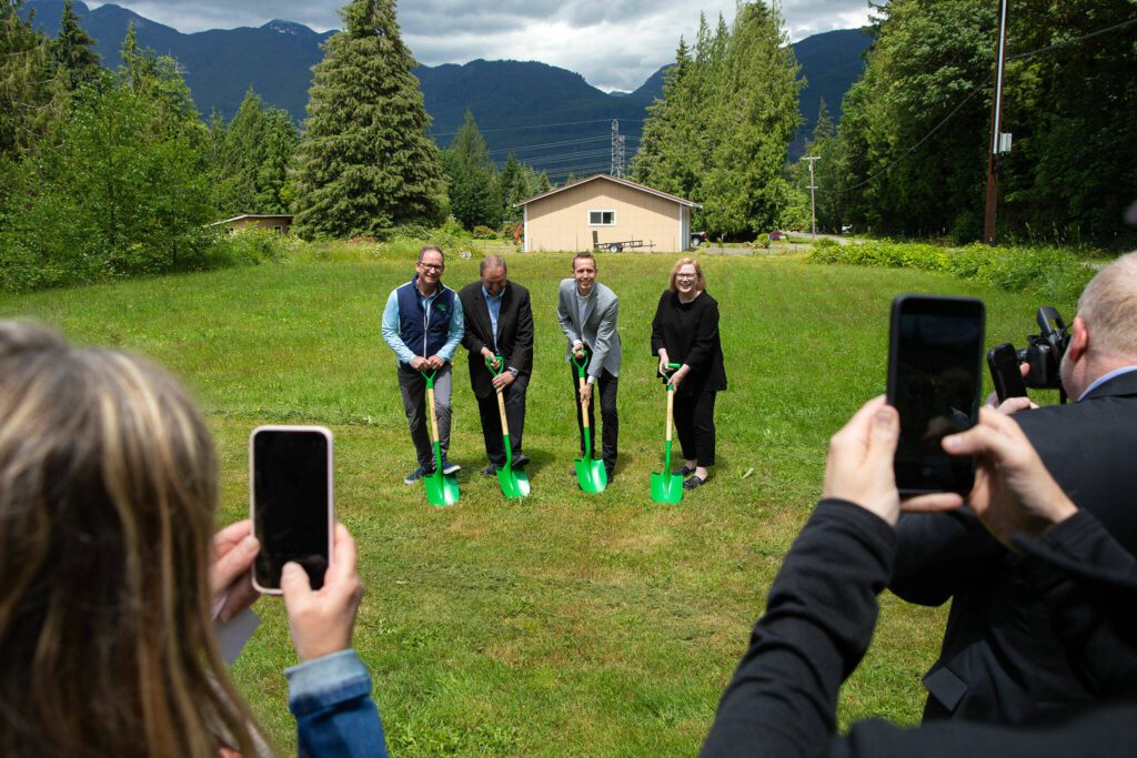 From left, Ziply CMO Mike Doherty, County Executive Dave Somers, Council Member Nate Nehring and Sno-Isle Libraries’ Lois Langer Thompson break ground during a press conference and groundbreaking for the SR 530 Broadband Project on Wednesday, June 26, 2024, at Darrington Fire District Station 38 outside Darrington, Washington. (Ryan Berry / The Herald)
