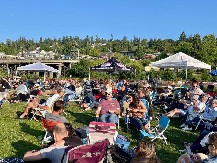 People kick back in their lawn chairs while listening to live music at Mukilteo’s Lighthouse Park during a previous year’s Music at the Beach event. This year’s concert series begins June 29. (Photo courtesy of the Mukilteo Chamber of Commerce)