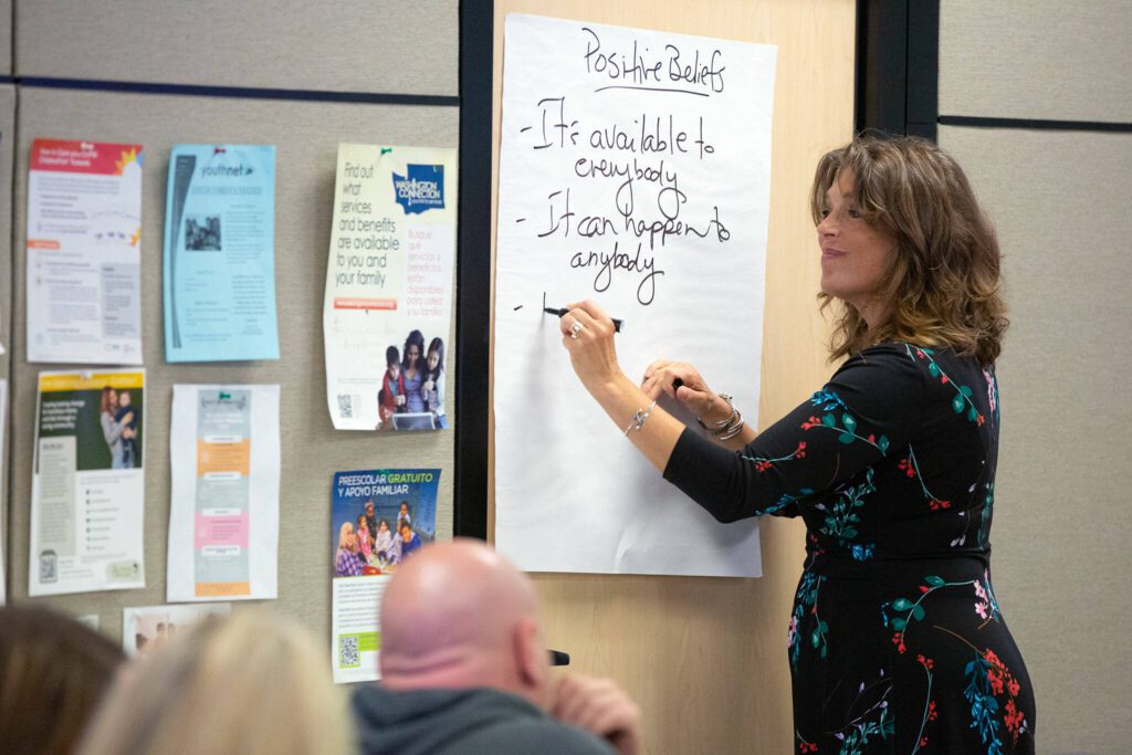 Tedra Cobb, consult trainer for the Medicine Recovery Center of Excellence out of New York, guides a group in listing positive beliefs during a community conversation about opioid use disorder on Thursday, June 27, 2024, at the St. Vincent DePaul Resource Center in Monroe, Washington. (Ryan Berry / The Herald)
