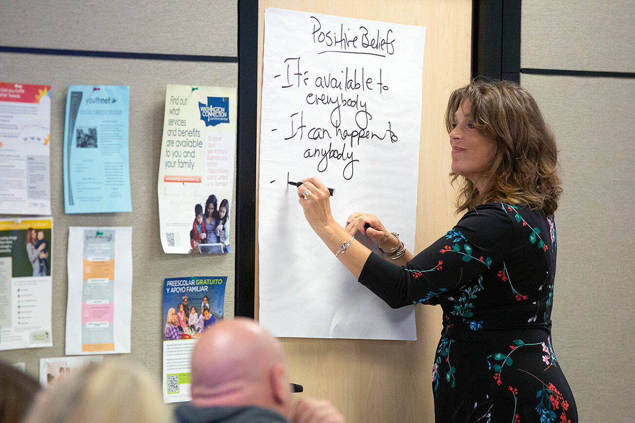 Tedra Cobb, consult trainer for the Medicine Recovery Center of Excellence out of New York, guides a group in listing positive beliefs during a community conversation about opioid use disorder on Thursday, June 27, 2024, at the St. Vincent DePaul Resource Center in Monroe, Washington. (Ryan Berry / The Herald)
