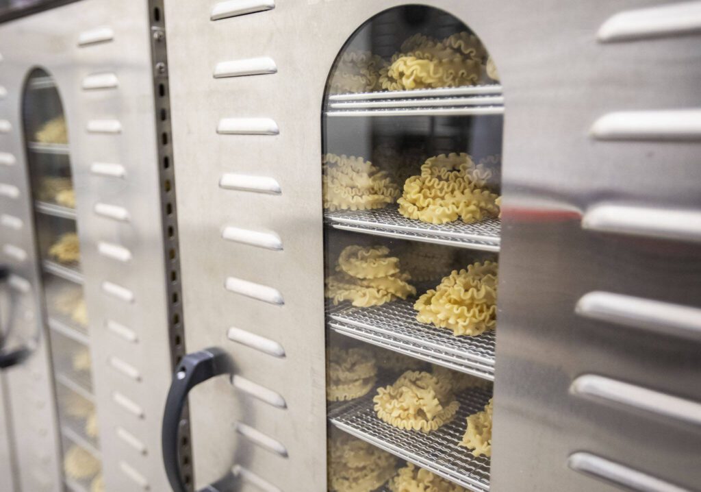 Fresh pasta sits inside a dryer at Wildly Beloved Foods on Thursday, June 27, 2024 in Clinton, Washington. (Olivia Vanni / The Herald)
