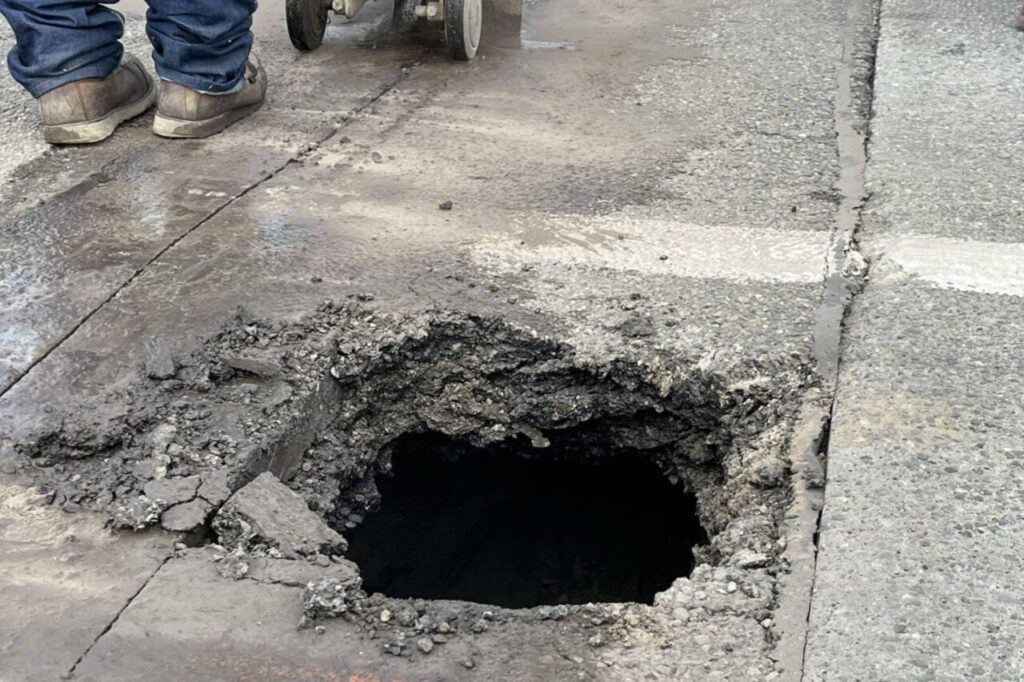 A person digging under Highway 529 created a hole in the road Tuesday, July 2, 2024, near Everett. (WSDOT photo)
