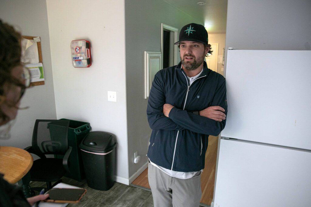 Travis Gannon, founder of Hand Up Housing, takes part in an interview at one of the residences on May 31, 2024, in Edmonds, Washington. (Ryan Berry / The Herald)
