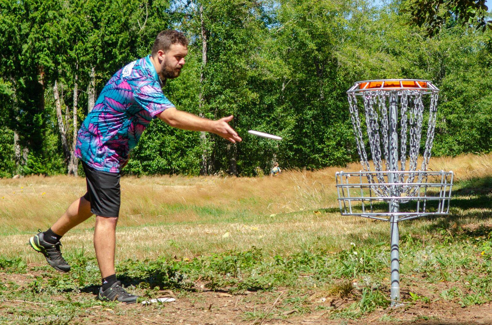 Chandler Fry makes a short birdie putt on Hole 6 on Kayak Point Disc Golf Resort’s Red Course. Fry is a professional from Olympia, Wash., and he has tallied 31 career wins. He will be one of the players in this year’s Mixed Pro Open (MPO) division. (Photo courtesy Andy Jaynes)