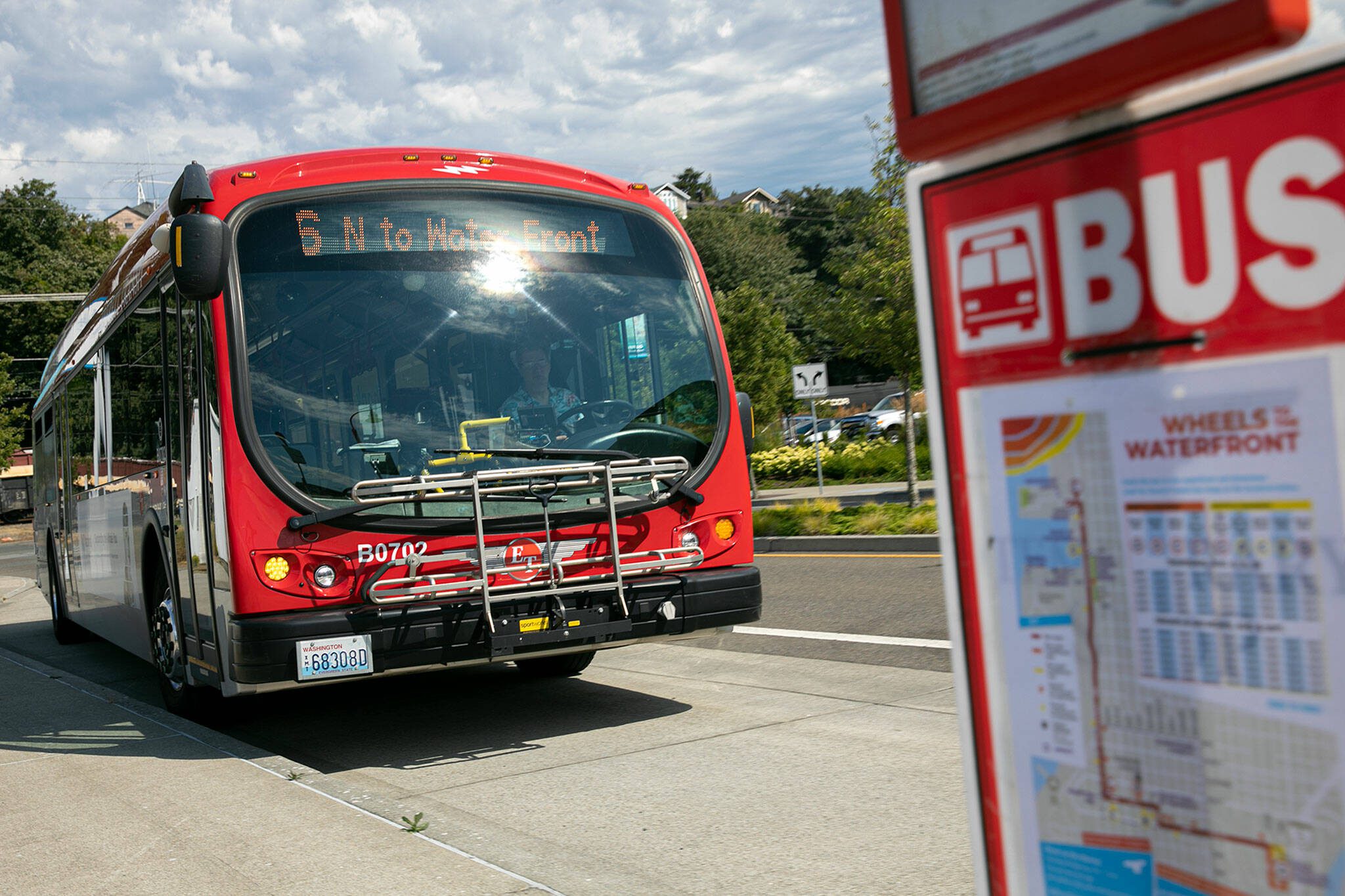 An Everett Transit Route 6 bus arrives at the 13th Street stop near the Port of Everett on Aug. 1, 2022, in Everett, Washington. (Ryan Berry / The Herald)